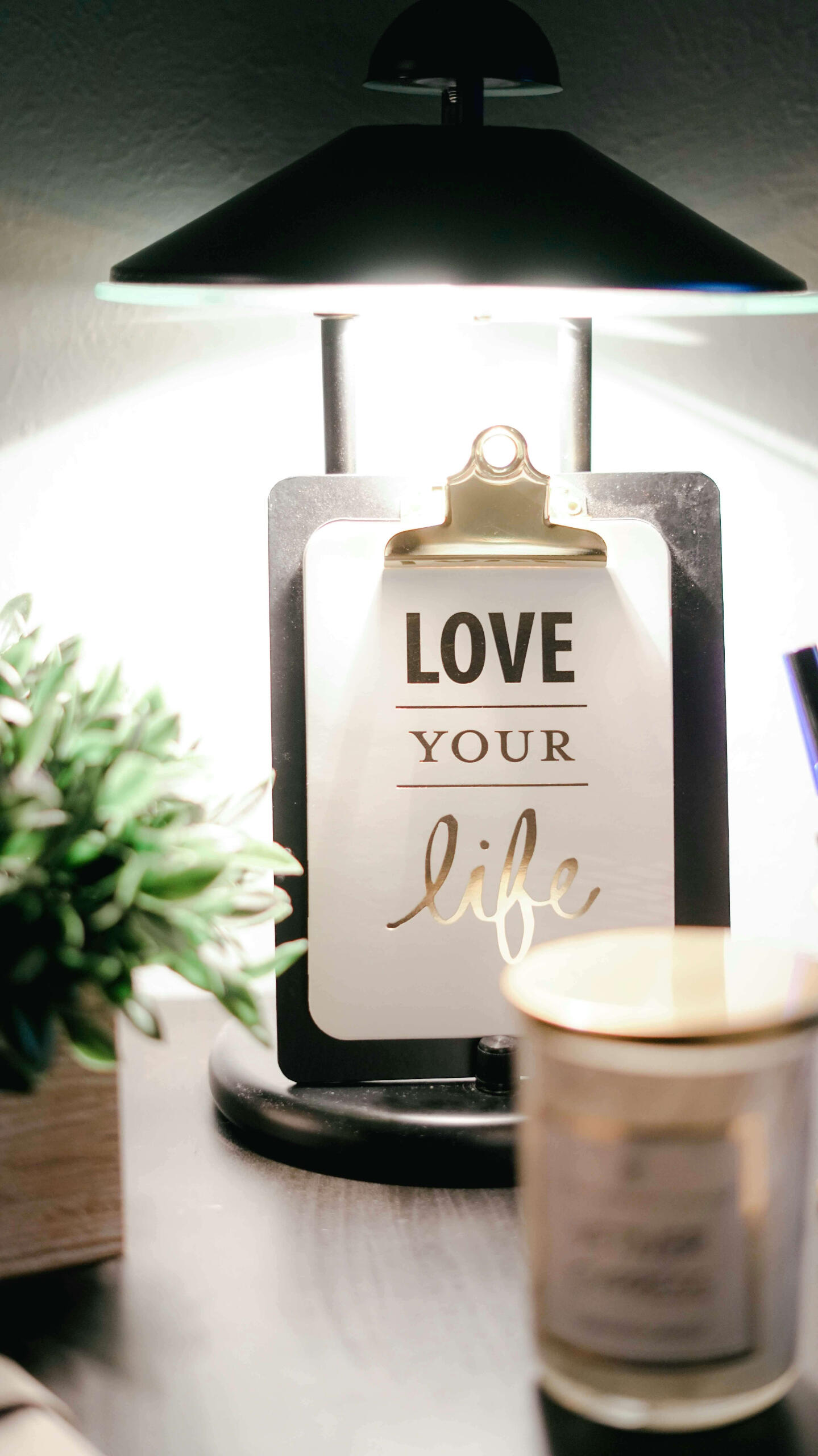 Love your life This is a photo of a Love Your Life sign next to some flowers and a candle